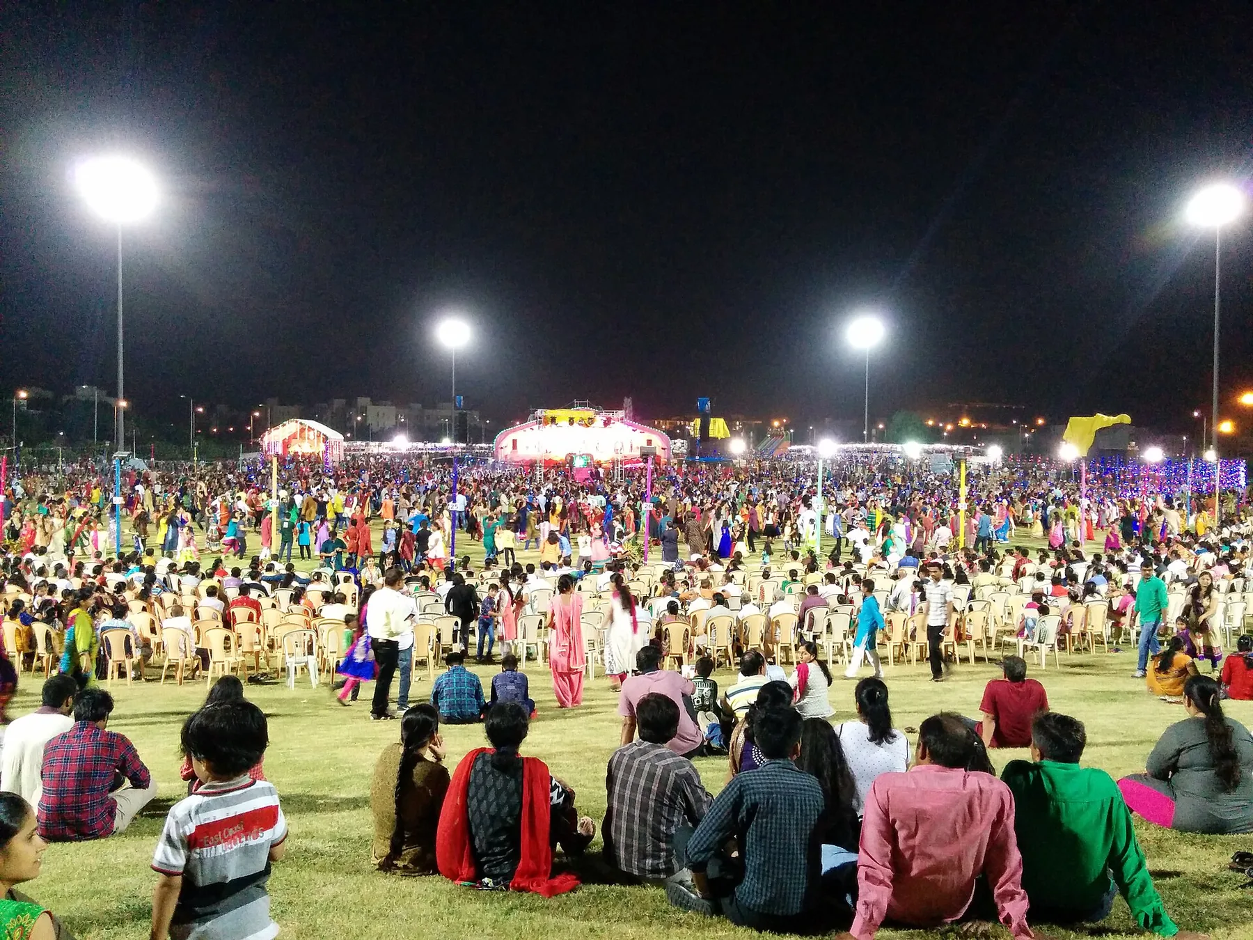 Friends forming a circle for Garba