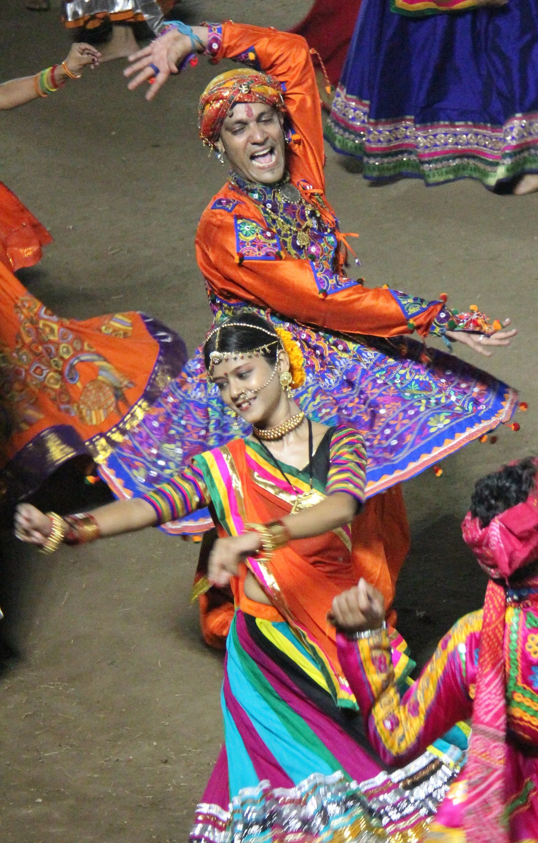 Garba dancer caught mid-spin in a colourful embroidered skirt